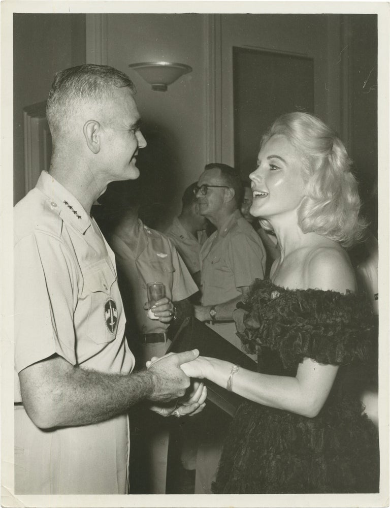 Book #171665] Original press photograph of Carroll Baker and General Westmoreland, 1965. William...