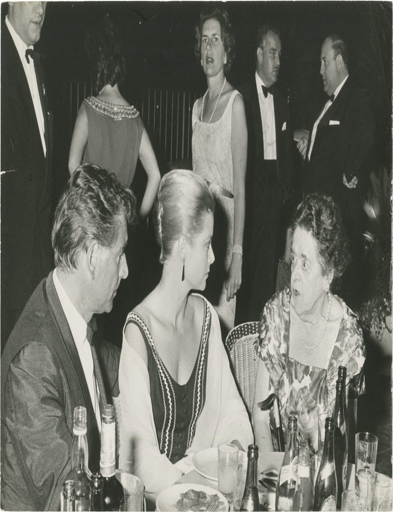 Book #171667] Original photograph of Elsa Maxwell with Leonard Bernstein and Grace Kelly at a...