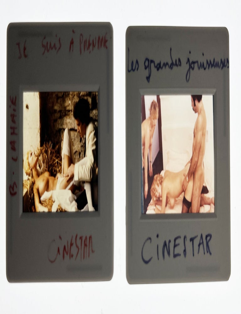 Book #171798] Collection of 13 original color slides from French adult films released by...